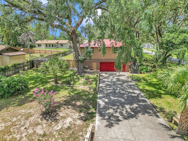 2676 SE 52nd Ave, Ocala, FL 34480 - ranch-style house with driveway, brick siding, and an attached garage