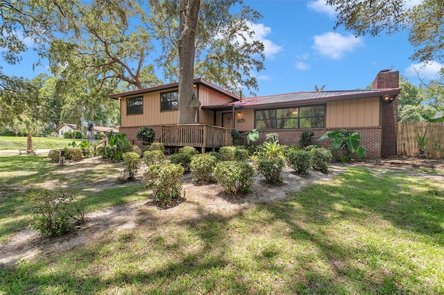 2676 SE 52nd Ave, Ocala, FL 34480 - rear view of property with brick siding and a chimney