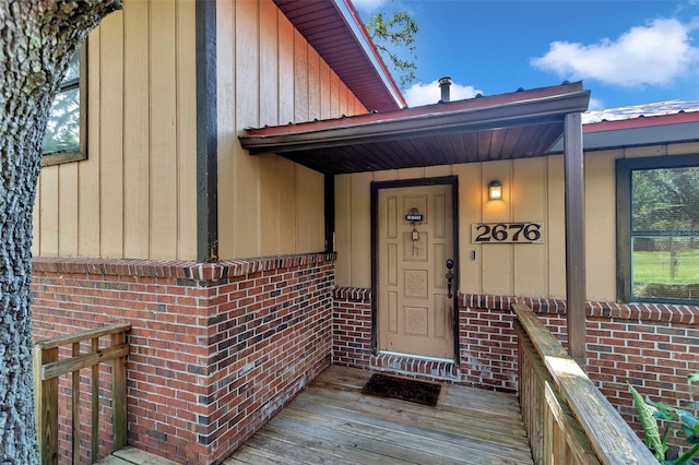 2676 SE 52nd Ave, Ocala, FL 34480 - view of exterior entry featuring brick siding