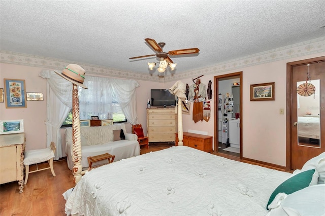 2676 SE 52nd Ave, Ocala, FL 34480 - bedroom with a textured ceiling, wood finished floors, and ceiling fan