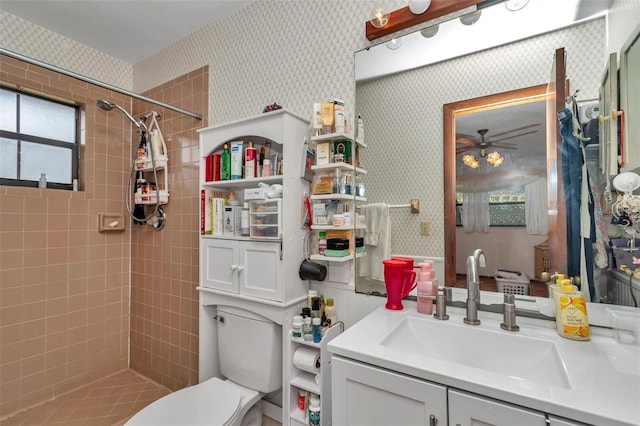 2676 SE 52nd Ave, Ocala, FL 34480 - bathroom with wallpapered walls, tiled shower, ceiling fan, and vanity