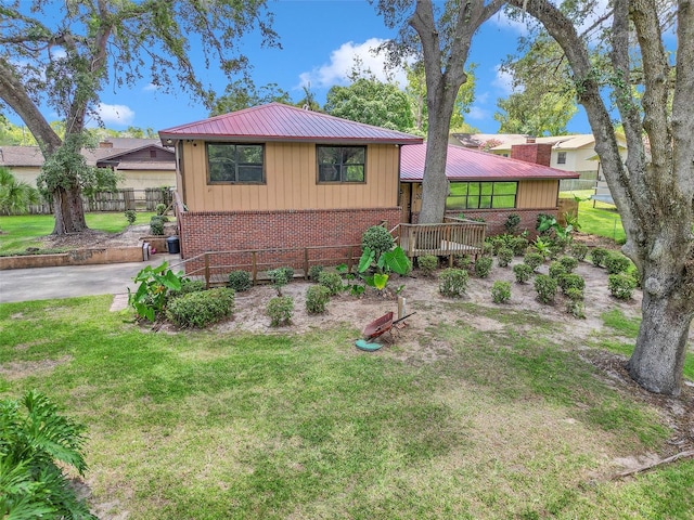 2676 SE 52nd Ave, Ocala, FL 34480 - view of front of house with brick siding and a metal roof
