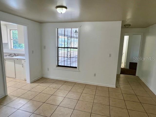 3801 SW 147th Lane Rd, Ocala, FL 34473 - unfurnished dining area with light tile patterned floors