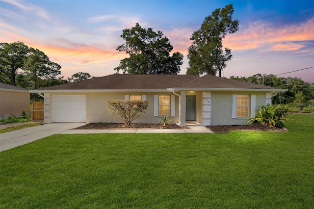 5596 NW 57th St, Ocala, FL 34482 - single story home with concrete driveway, a garage, stucco siding, and a yard