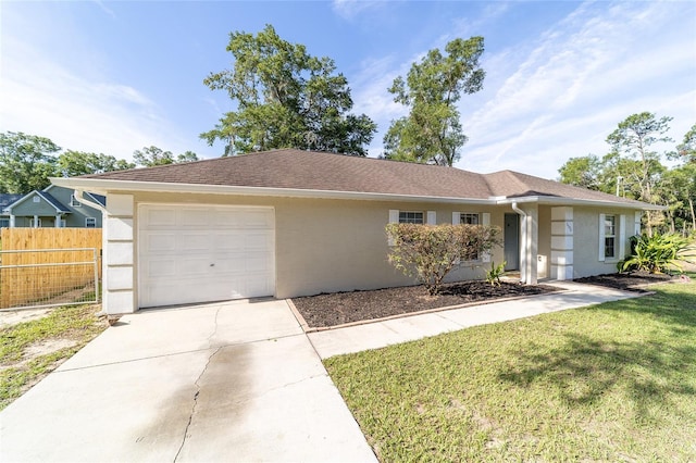 5596 NW 57th St, Ocala, FL 34482 - ranch-style house with stucco siding, an attached garage, and driveway