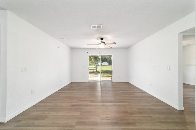 5596 NW 57th St, Ocala, FL 34482 - empty room featuring ceiling fan and wood finished floors