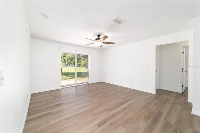 5596 NW 57th St, Ocala, FL 34482 - spare room featuring a ceiling fan, wood finished floors, and a smoke detector
