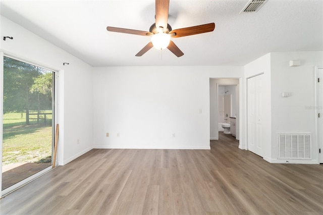 5596 NW 57th St, Ocala, FL 34482 - empty room with wood finished floors and ceiling fan