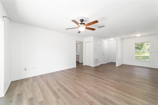 5596 NW 57th St, Ocala, FL 34482 - unfurnished living room featuring light wood-style floors and ceiling fan