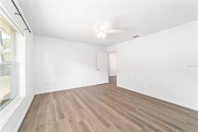 5596 NW 57th St, Ocala, FL 34482 - empty room featuring light wood finished floors and a ceiling fan