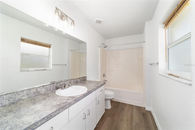 5596 NW 57th St, Ocala, FL 34482 - full bath with vanity, wood finished floors, and tub / shower combination