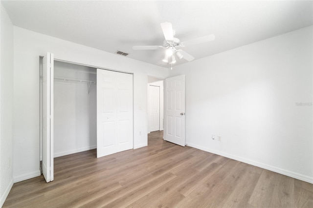 5596 NW 57th St, Ocala, FL 34482 - unfurnished bedroom featuring light wood-style floors, a closet, and ceiling fan