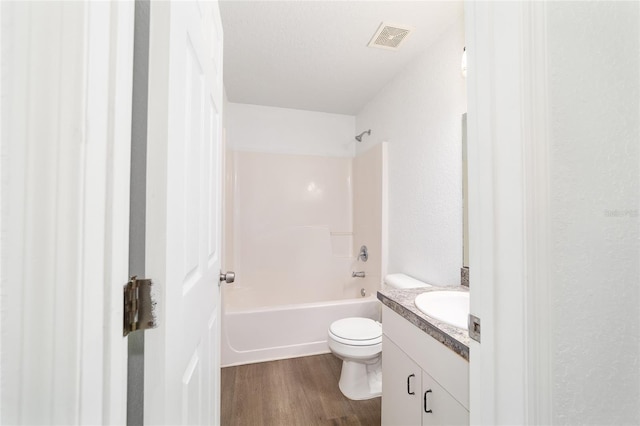 5596 NW 57th St, Ocala, FL 34482 - bathroom featuring vanity, wood finished floors, and shower / washtub combination