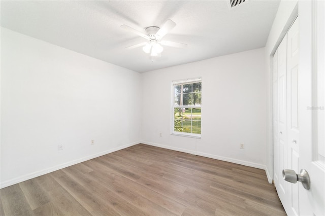 5596 NW 57th St, Ocala, FL 34482 - unfurnished bedroom featuring light wood-style flooring, a closet, and a ceiling fan