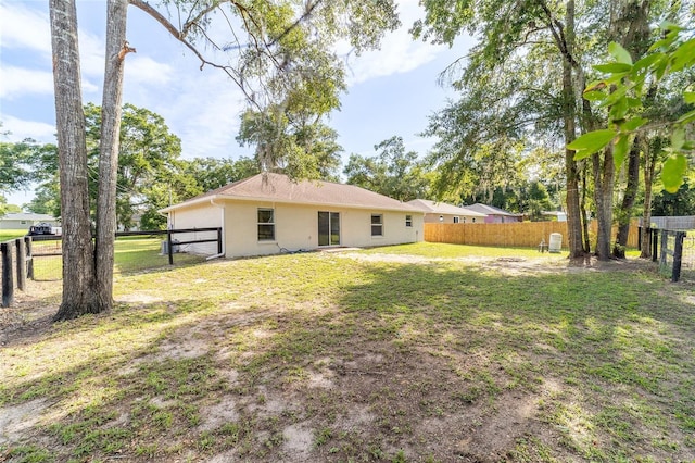 5596 NW 57th St, Ocala, FL 34482 - rear view of property with stucco siding