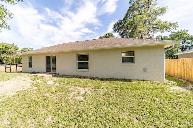5596 NW 57th St, Ocala, FL 34482 - back of house with a fenced backyard and stucco siding