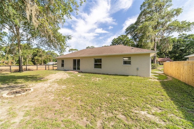 5596 NW 57th St, Ocala, FL 34482 - rear view of house with a fenced backyard