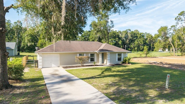5596 NW 57th St, Ocala, FL 34482 - view of front of house featuring a garage, driveway, stucco siding, a front lawn, and view of wooded area