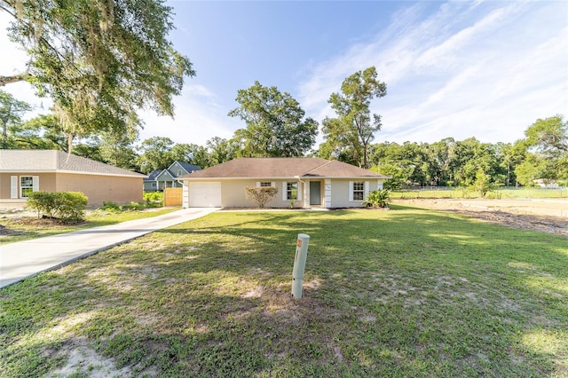 5596 NW 57th St, Ocala, FL 34482 - ranch-style home with driveway, an attached garage, and stucco siding