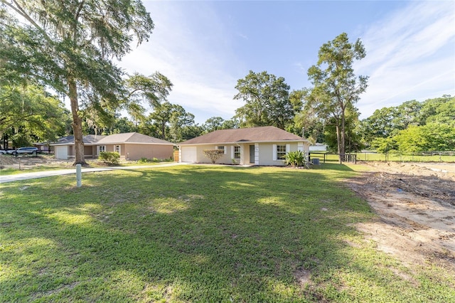 5596 NW 57th St, Ocala, FL 34482 - ranch-style home featuring an attached garage, driveway, and stucco siding
