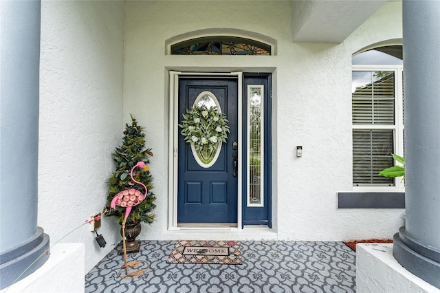 19115 SW 98th Loop, Dunnellon, FL 34432 - property entrance featuring stucco siding