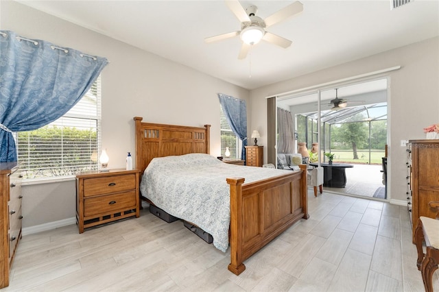 19115 SW 98th Loop, Dunnellon, FL 34432 - bedroom with access to outside, light wood-style flooring, and multiple windows