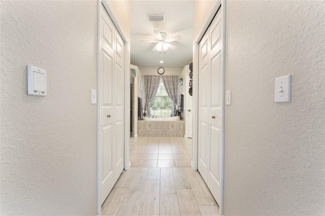 19115 SW 98th Loop, Dunnellon, FL 34432 - hallway featuring a textured wall