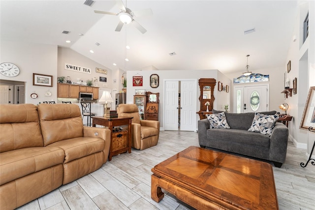 19115 SW 98th Loop, Dunnellon, FL 34432 - living room with high vaulted ceiling, ceiling fan, light wood finished floors, and recessed lighting