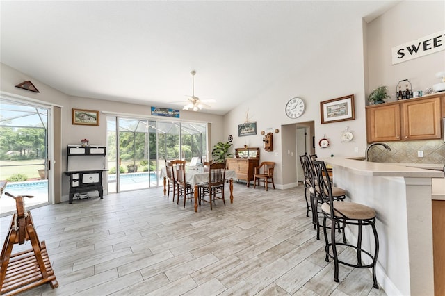 19115 SW 98th Loop, Dunnellon, FL 34432 - dining room with ceiling fan, light wood finished floors, and vaulted ceiling