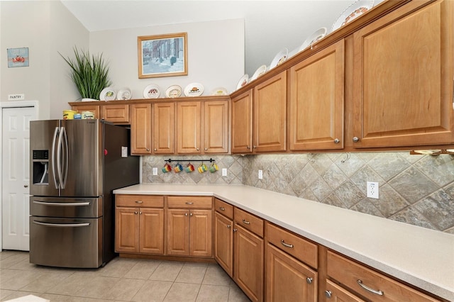 19115 SW 98th Loop, Dunnellon, FL 34432 - kitchen featuring stainless steel fridge, backsplash, and brown cabinets
