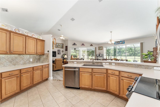 19115 SW 98th Loop, Dunnellon, FL 34432 - kitchen with dishwasher, ceiling fan, light tile patterned flooring, lofted ceiling, and light countertops
