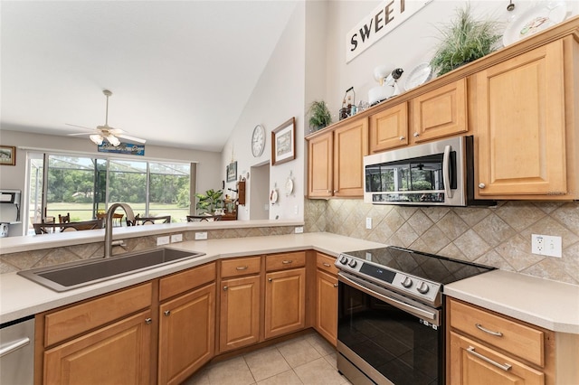 19115 SW 98th Loop, Dunnellon, FL 34432 - kitchen with appliances with stainless steel finishes, ceiling fan, tasteful backsplash, light countertops, and light tile patterned flooring