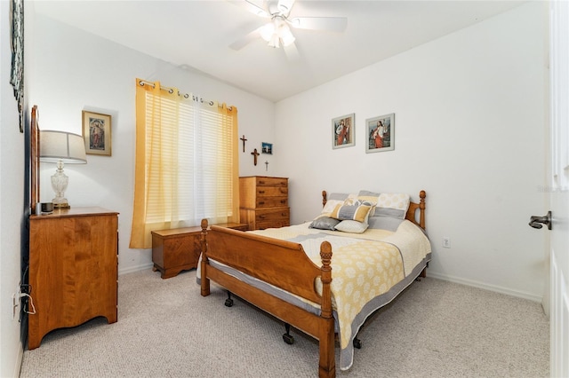 19115 SW 98th Loop, Dunnellon, FL 34432 - bedroom with light carpet and a ceiling fan
