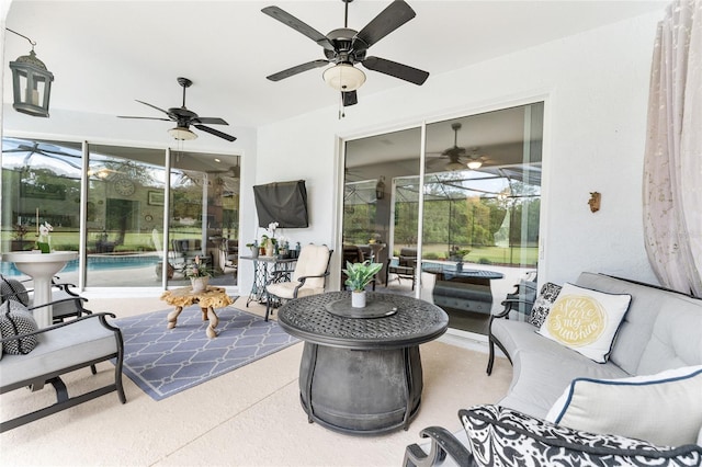 19115 SW 98th Loop, Dunnellon, FL 34432 - view of patio featuring a ceiling fan, an outdoor pool, and an outdoor hangout area