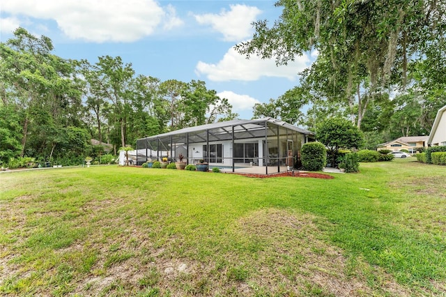 19115 SW 98th Loop, Dunnellon, FL 34432 - back of property with a yard and a lanai