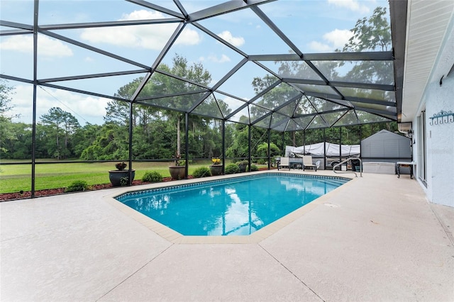 19115 SW 98th Loop, Dunnellon, FL 34432 - swimming pool with a patio, a storage shed, a lawn, and view of wooded area