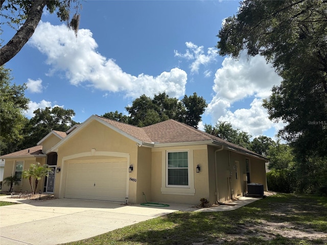 19480 SW 100th Loop, Dunnellon, FL 34432 - single story home with an attached garage, stucco siding, concrete driveway, and roof with shingles
