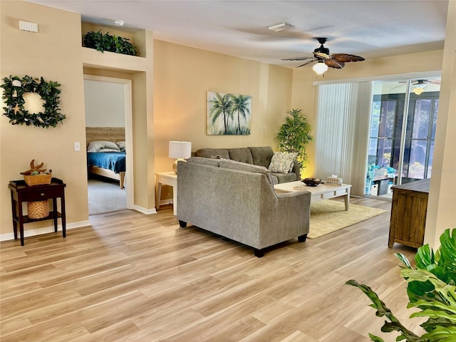 19480 SW 100th Loop, Dunnellon, FL 34432 - living room featuring ceiling fan and light wood-style flooring