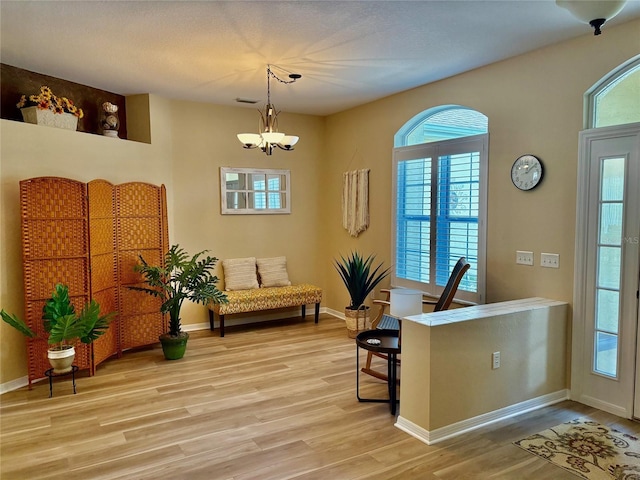 19480 SW 100th Loop, Dunnellon, FL 34432 - sitting room featuring light wood-style floors, a chandelier, and a desk