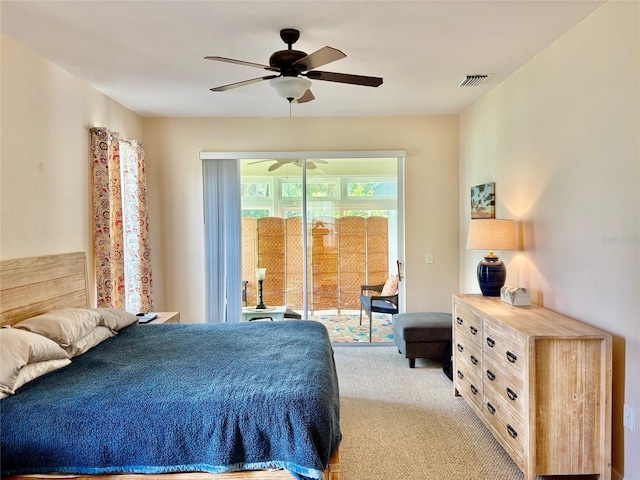 19480 SW 100th Loop, Dunnellon, FL 34432 - bedroom featuring access to outside, light carpet, and ceiling fan