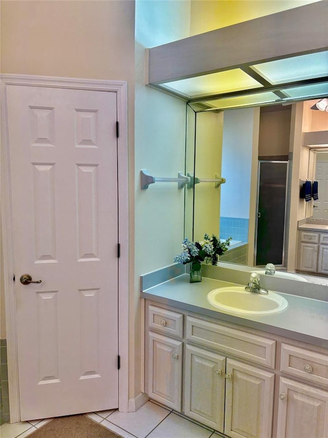 19480 SW 100th Loop, Dunnellon, FL 34432 - bathroom with vanity, tile patterned flooring, and an enclosed shower