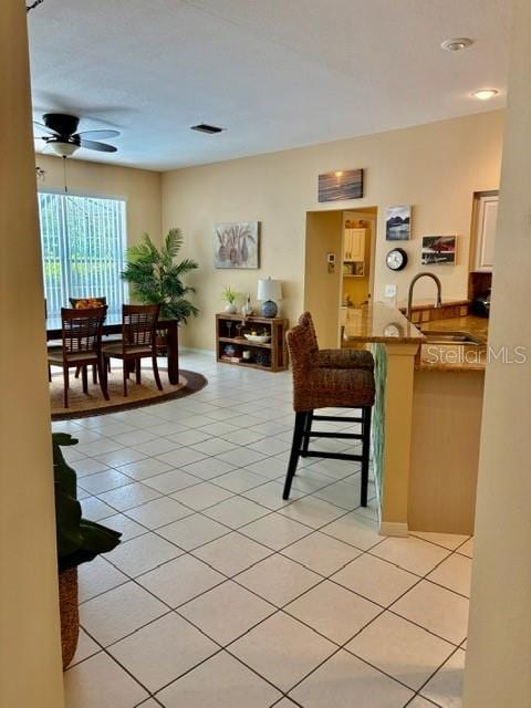 19480 SW 100th Loop, Dunnellon, FL 34432 - living room with ceiling fan and light tile patterned floors
