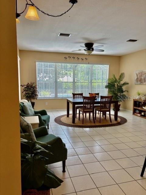 19480 SW 100th Loop, Dunnellon, FL 34432 - living room featuring light tile patterned floors and ceiling fan