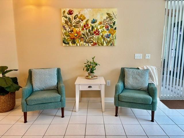 19480 SW 100th Loop, Dunnellon, FL 34432 - sitting room with baseboards and tile patterned flooring