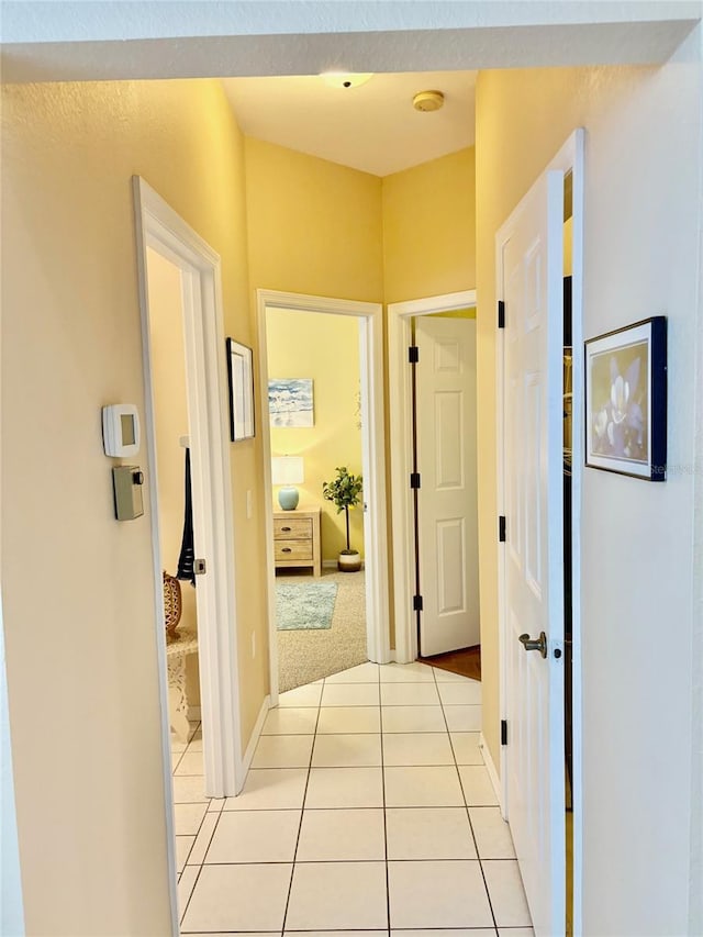 19480 SW 100th Loop, Dunnellon, FL 34432 - hallway with light tile patterned floors and baseboards
