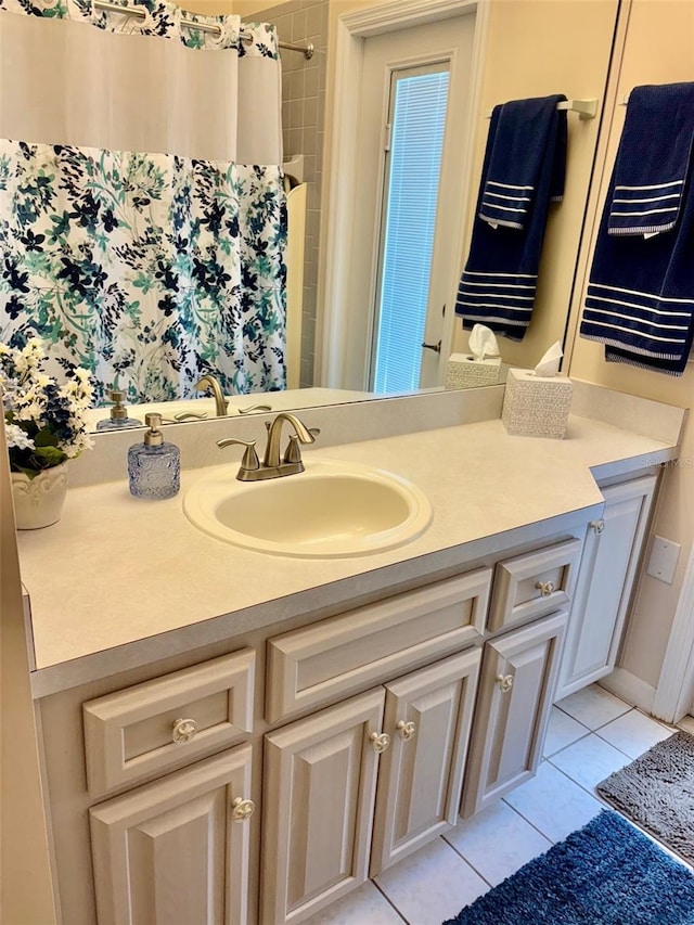 19480 SW 100th Loop, Dunnellon, FL 34432 - full bathroom with vanity, tile patterned flooring, and curtained shower