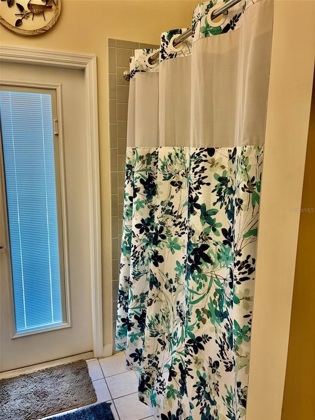 19480 SW 100th Loop, Dunnellon, FL 34432 - bathroom featuring tile patterned floors and a shower with shower curtain