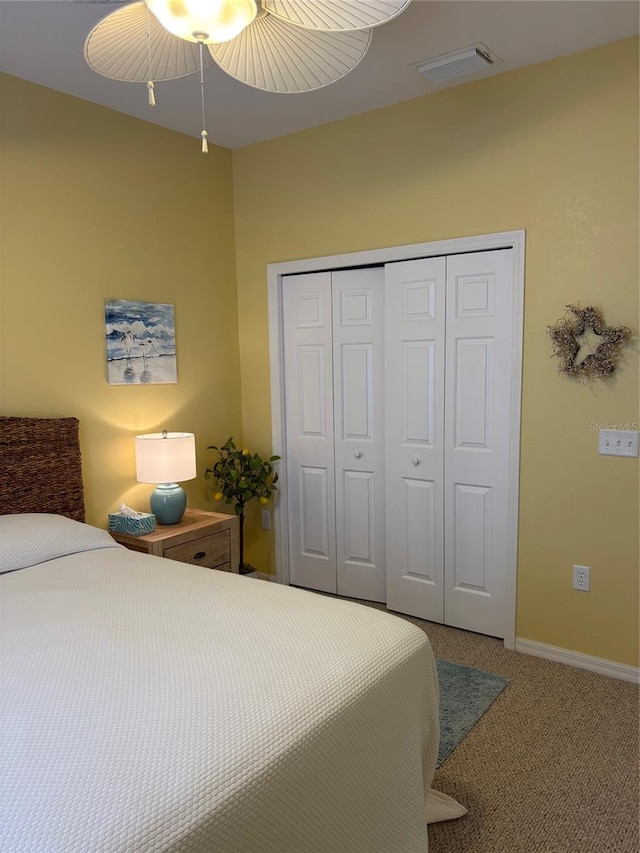 19480 SW 100th Loop, Dunnellon, FL 34432 - carpeted bedroom featuring a closet and a ceiling fan