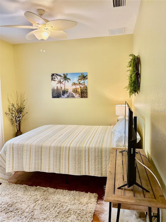 19480 SW 100th Loop, Dunnellon, FL 34432 - bedroom with wood finished floors and a ceiling fan