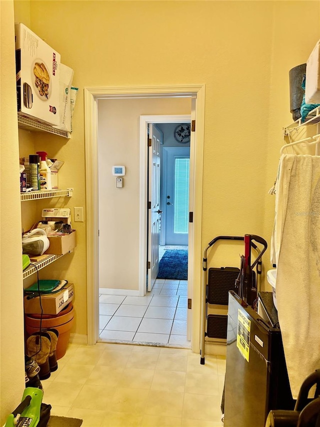 19480 SW 100th Loop, Dunnellon, FL 34432 - corridor featuring light tile patterned flooring and baseboards